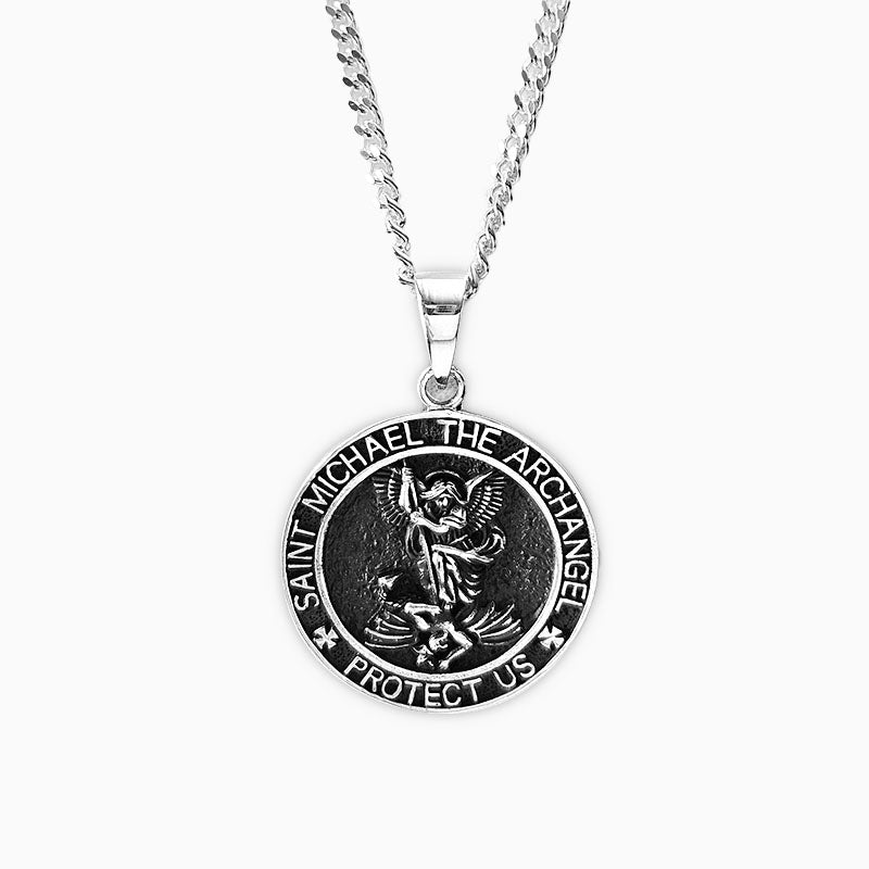 Silver necklace with a Saint Michael pendant on a white background