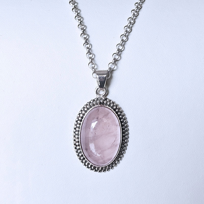 Necklace with a pink pendant on a white background