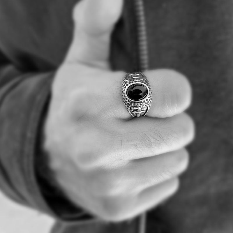 Men's Ring with a black onyx stone and a textured dagger design