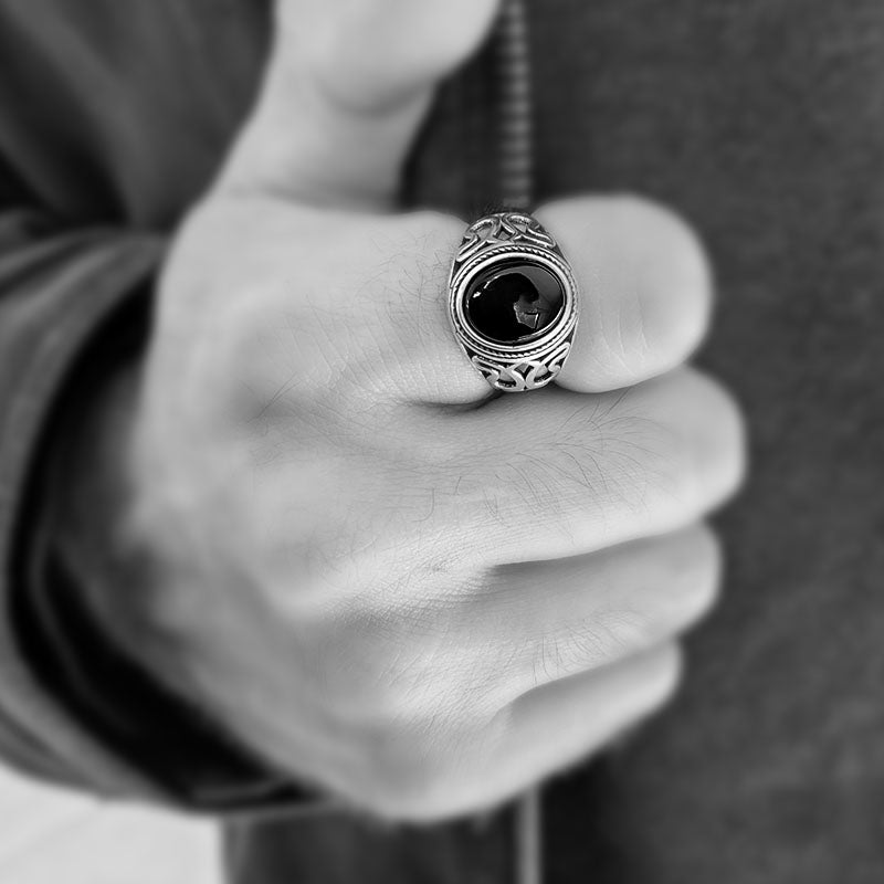 Onyx ring for men with lotus pattern on the sides of the ring. Made with sterling silver