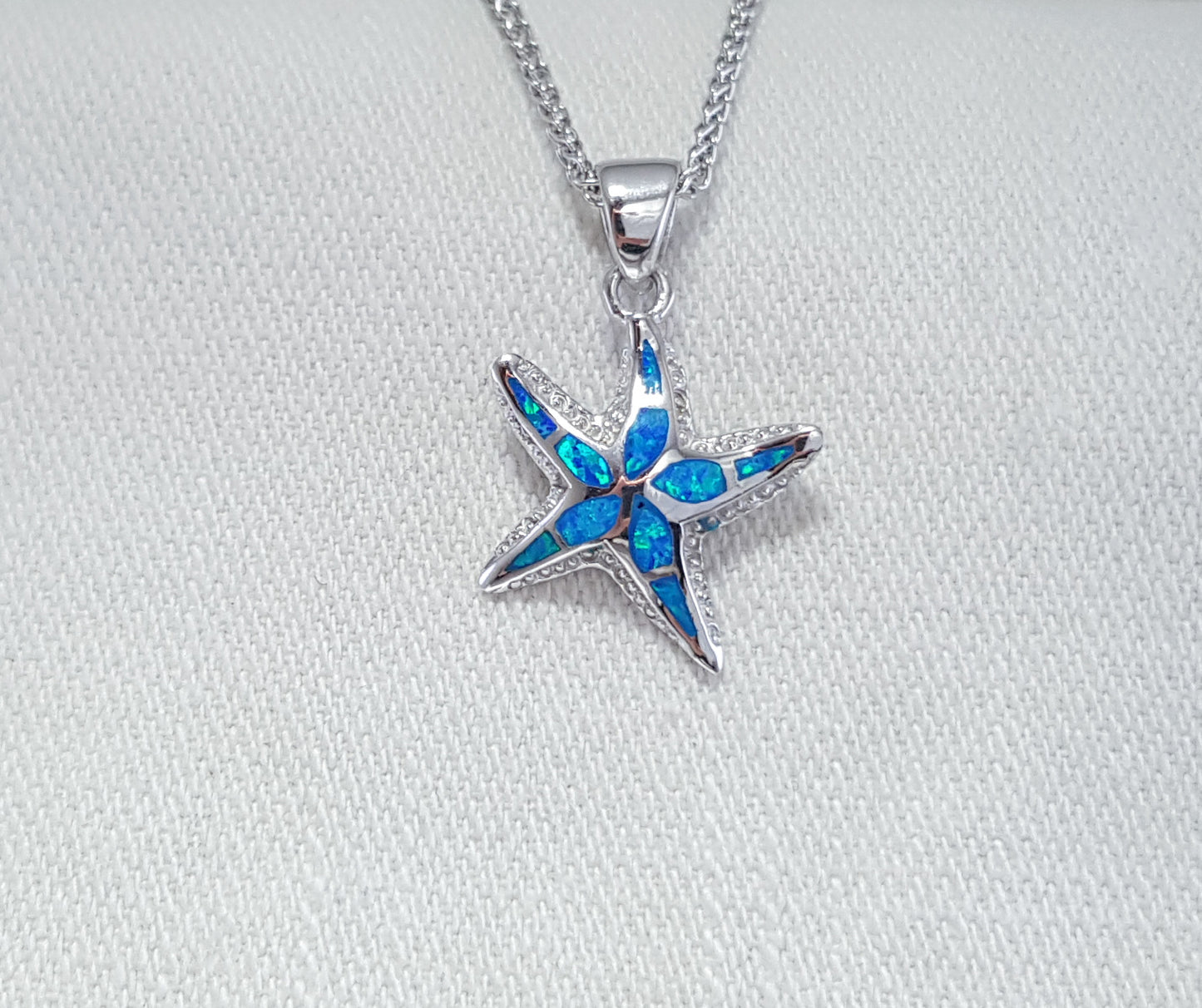 Crushed Opal starfish pendant set in Sterling Silver