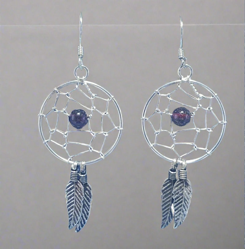Enchanting dream catcher drop earrings, reminiscent of a whimsical and spiritual charm.