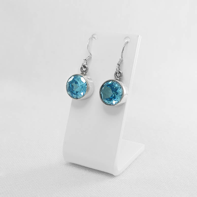 Sterling silver round topaz earrings with a faceted stone cut