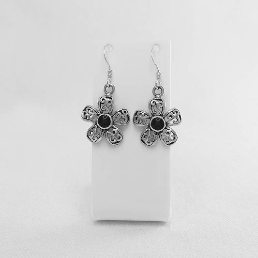 Sterling silver flower earrings with a black stone inlay