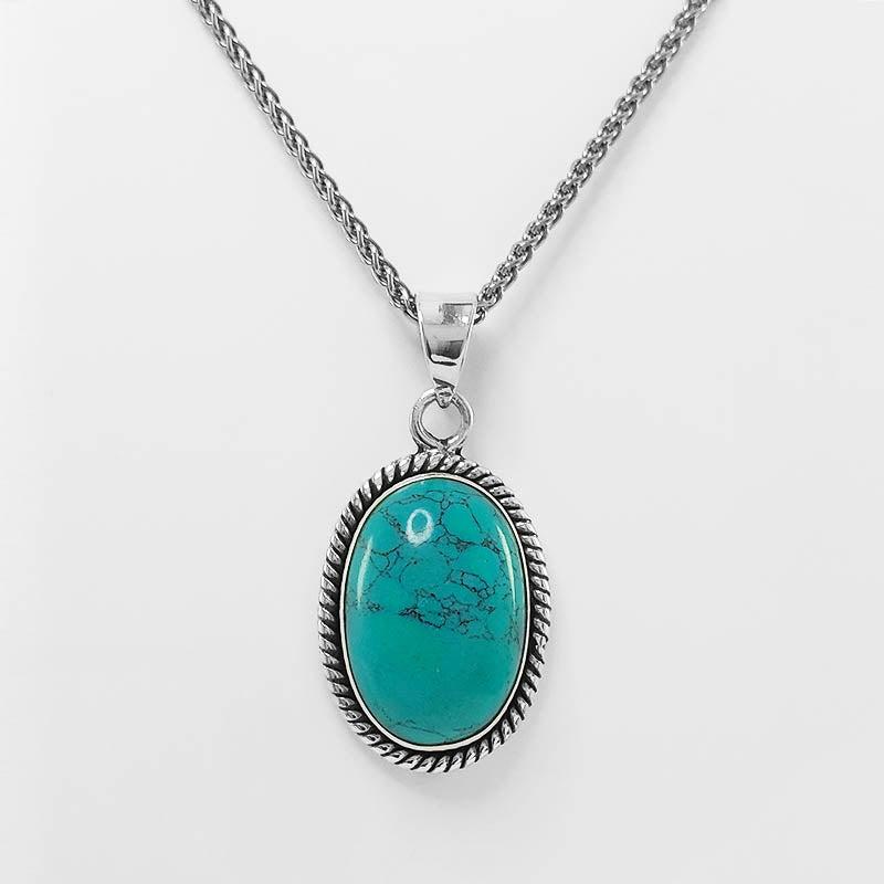 Large Oval Turquoise Pendant with a silver chain.