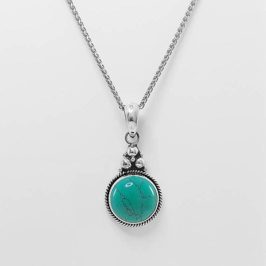 Sterling silver turquoise pendant with a silver chain.