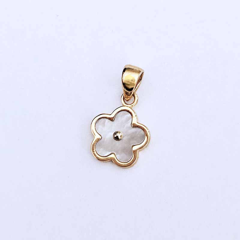 A gold five-petal flower pendant featuring a white mother-of-pearl inlay in the center, displayed on a clean white background.