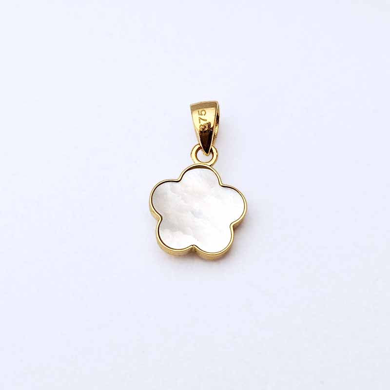 A gold five-petal flower pendant with a white mother-of-pearl inlay, shown on a clean white background.