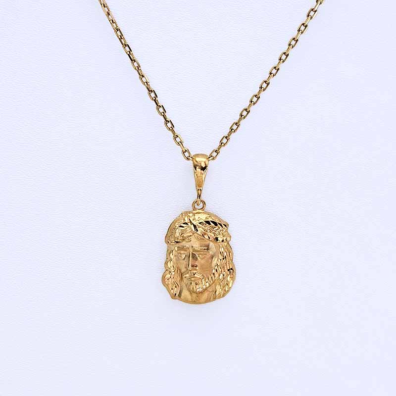 A gold Jesus Christ pendant necklace on a delicate gold chain, displayed against a clean white background.