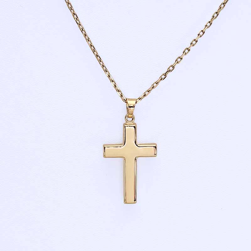 A gold cross pendant necklace on a delicate gold chain, presented against a clean white background.