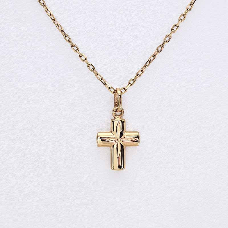 A gold cross pendant necklace on a delicate gold chain, displayed against a clean white background.