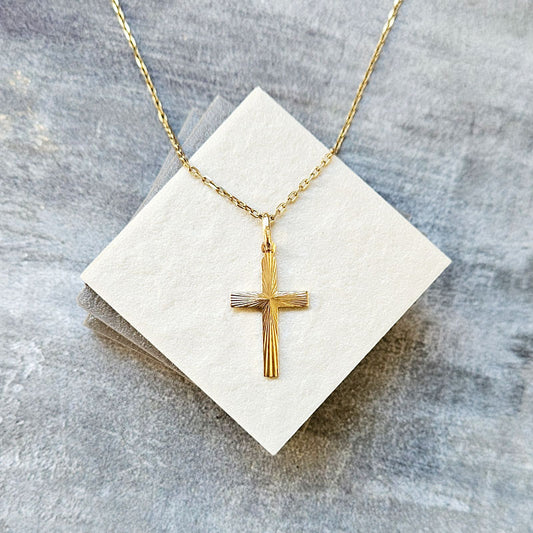 9 carat gold cross pendant with a textured design 