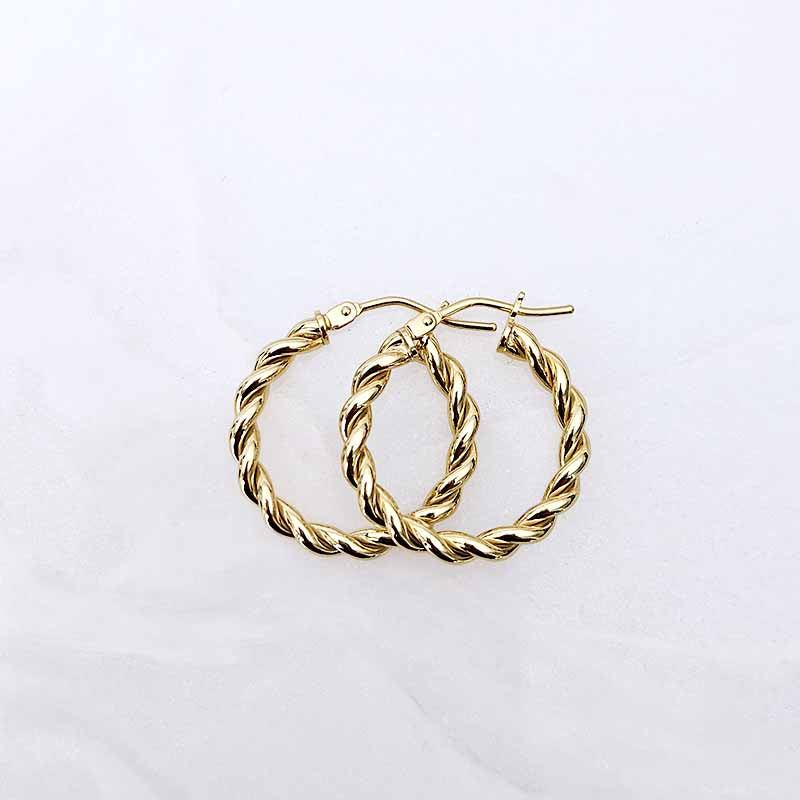 A pair of gold hoop earrings with a twisted rope texture, displayed on a clean white background.