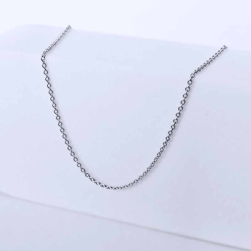 Platinum chain necklace on a light gray background