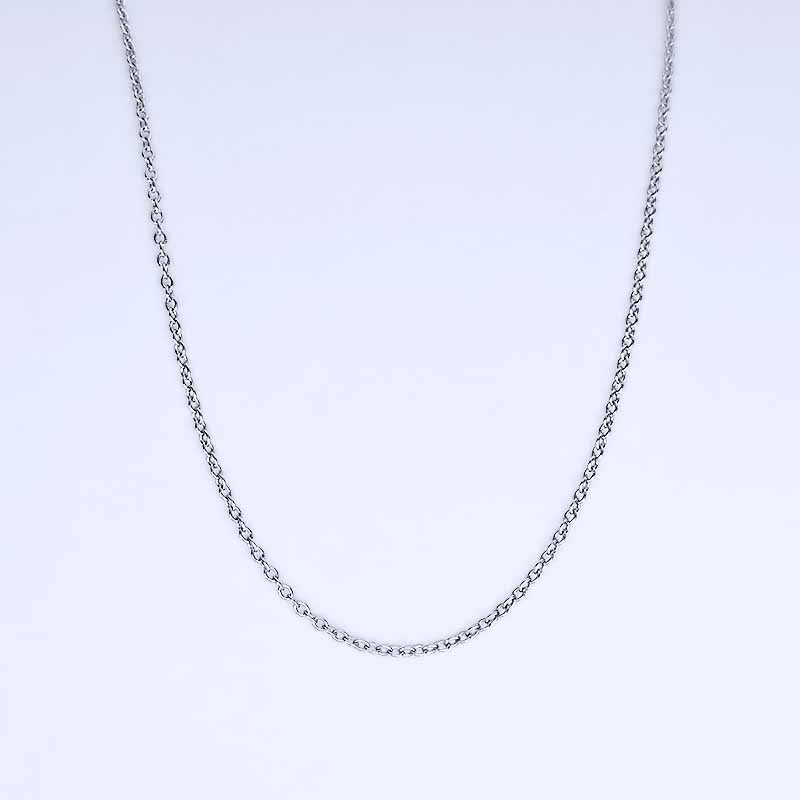 Platinum chain necklace on a light purple background