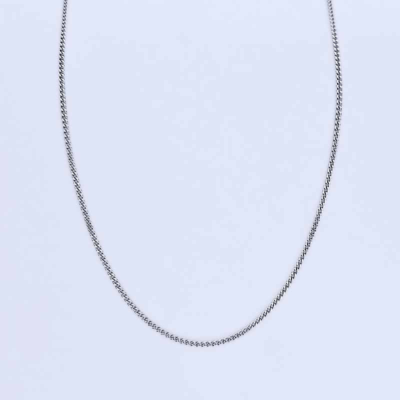 Platinum necklace on a light gray background