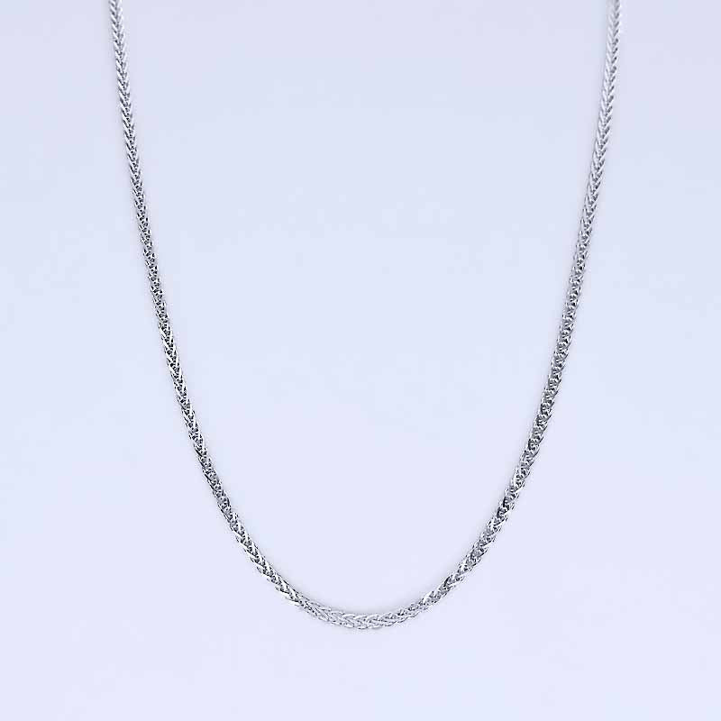 Platinum chain necklace on a light gray background