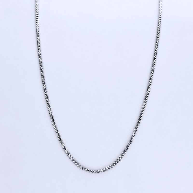 Platinum chain necklace on a light gray background