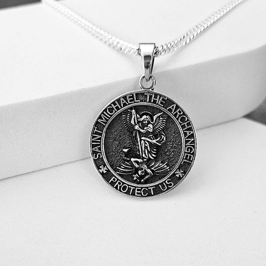 Silver Saint Michael the Archangel pendant on a white background