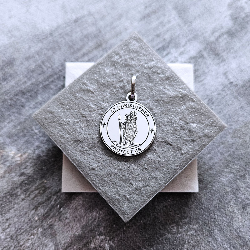 Silver St. Christopher pendant on a gray square card with a marble background