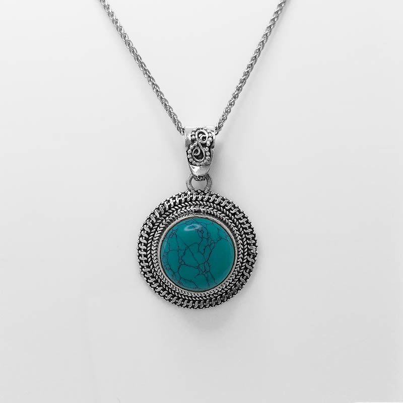 Round Turquoise Stone set in Balinese-styled silver setting