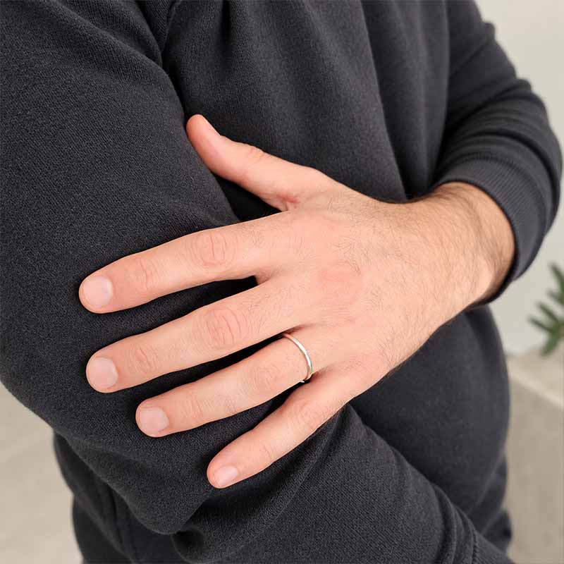 Sterling Silver Plain Band  on a male hand wearing a dark jersey
