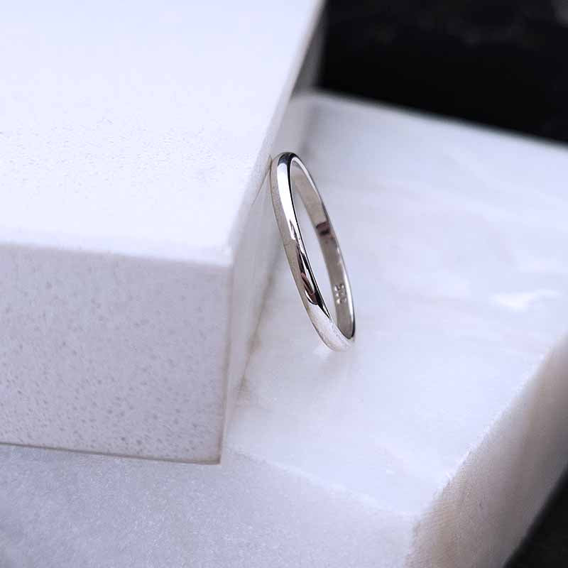 Sterling Silver Plain Band  on a marble surface