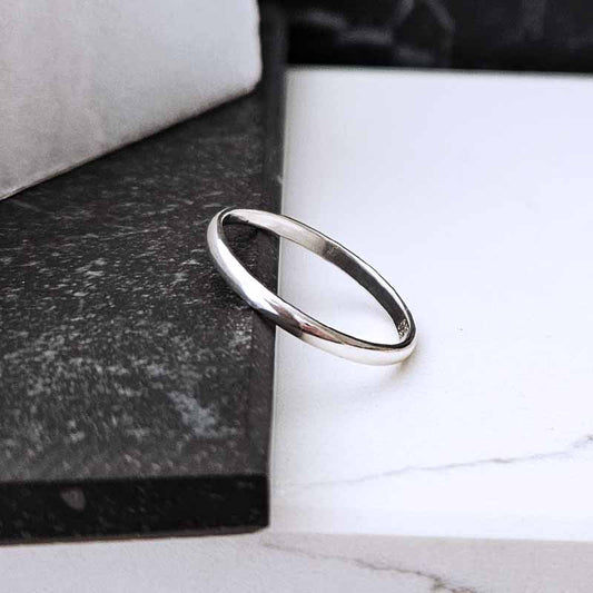 Sterling Silver Plain Band  on a marble surface