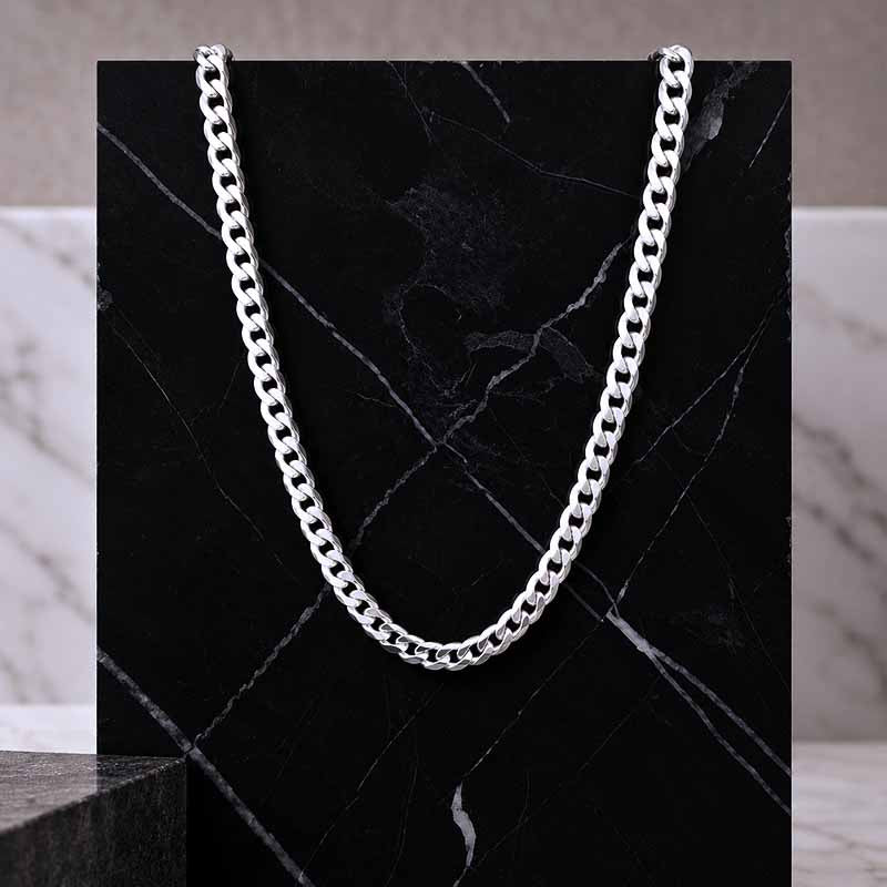 silver chain on a dark marbled tile