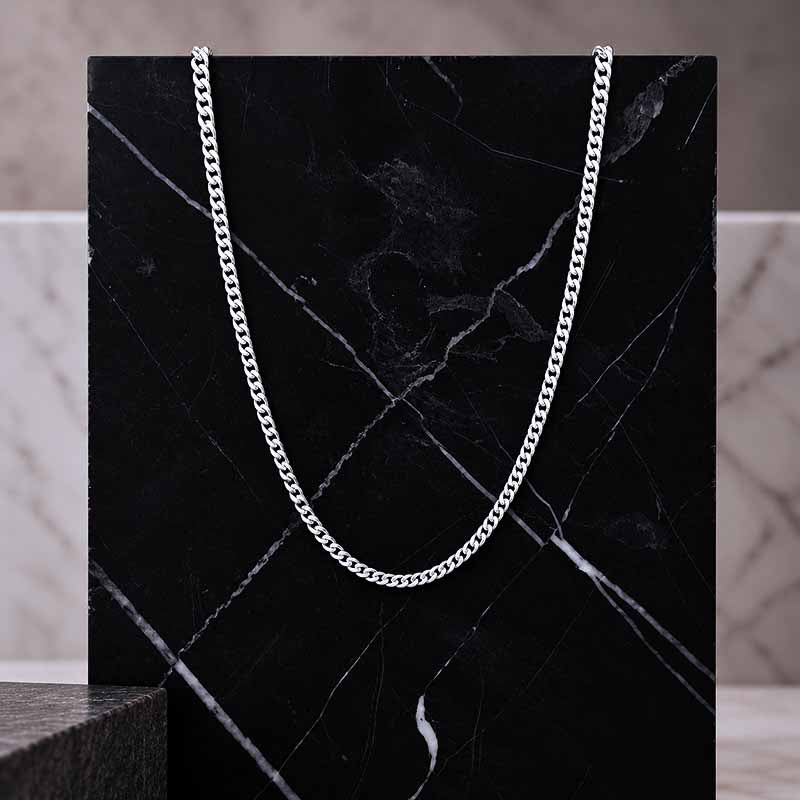 Sterling Silver Curb Chain on a black marble surface
