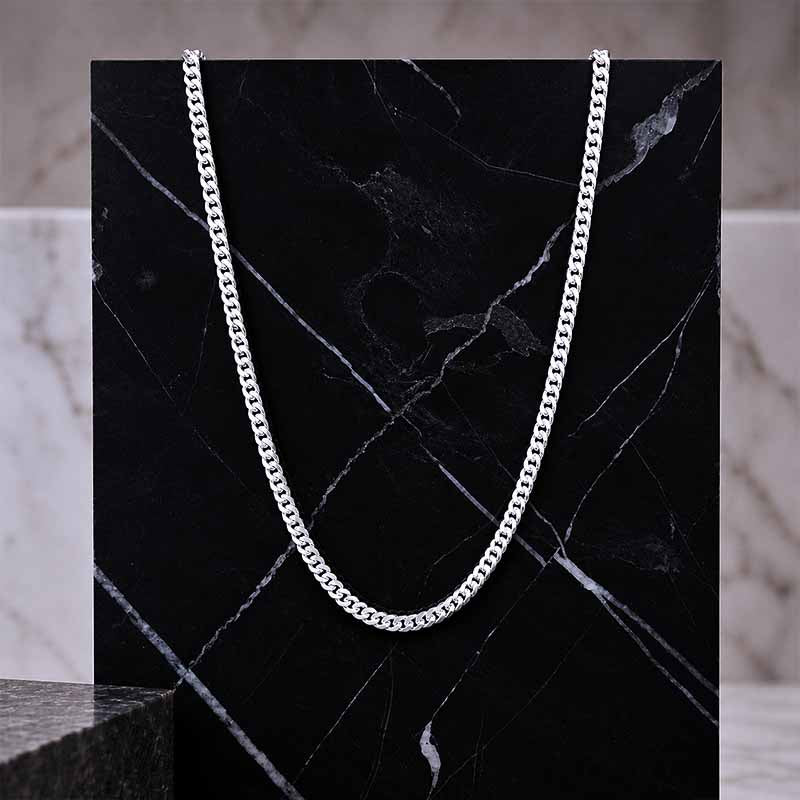 Sterling Silver Curb Chain on a luxurious black marble surface