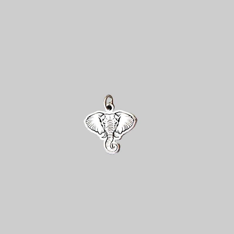 Silver elephant pendant on a light gray background