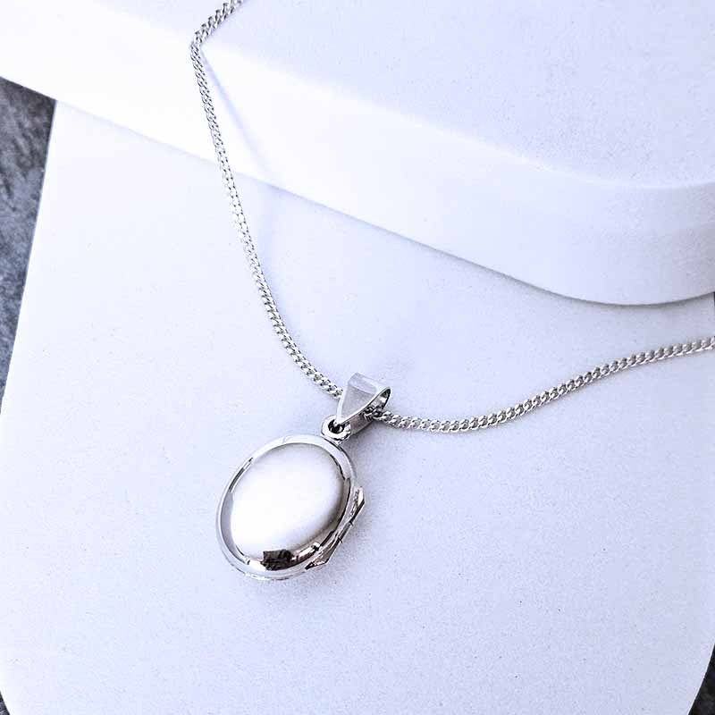 Silver necklace with a pendant on a white background