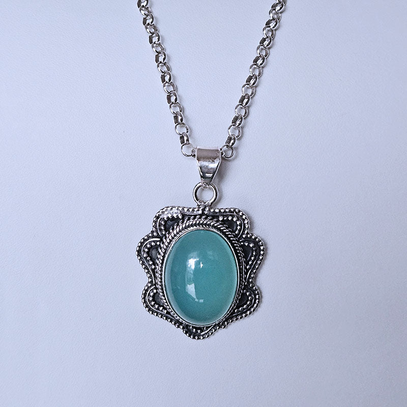 Necklace with a Chelcedony pendant on a light gray background