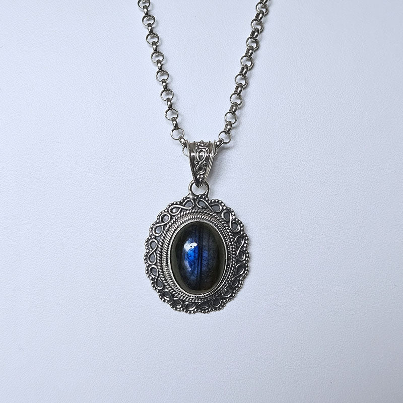 Silver necklace with a Labradorite  gemstone pendant on a white background