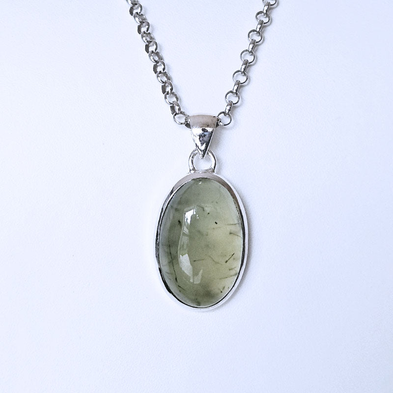 Necklace with a green Prehnite pendant on a white background