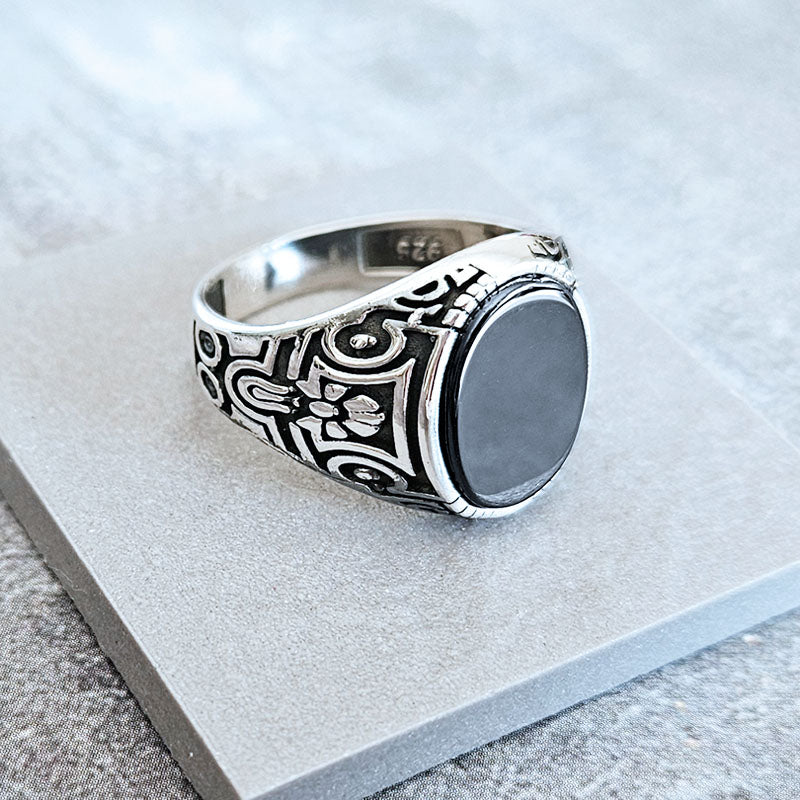 Silver ring for men with textured pattern and black onyx stone