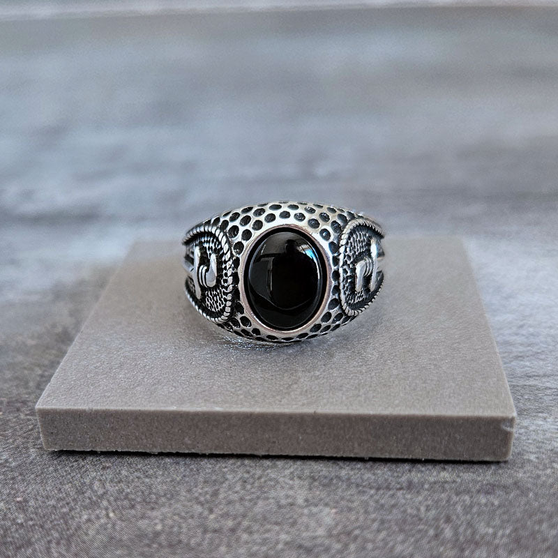 Men's Ring with a black onyx stone and a textured dagger design