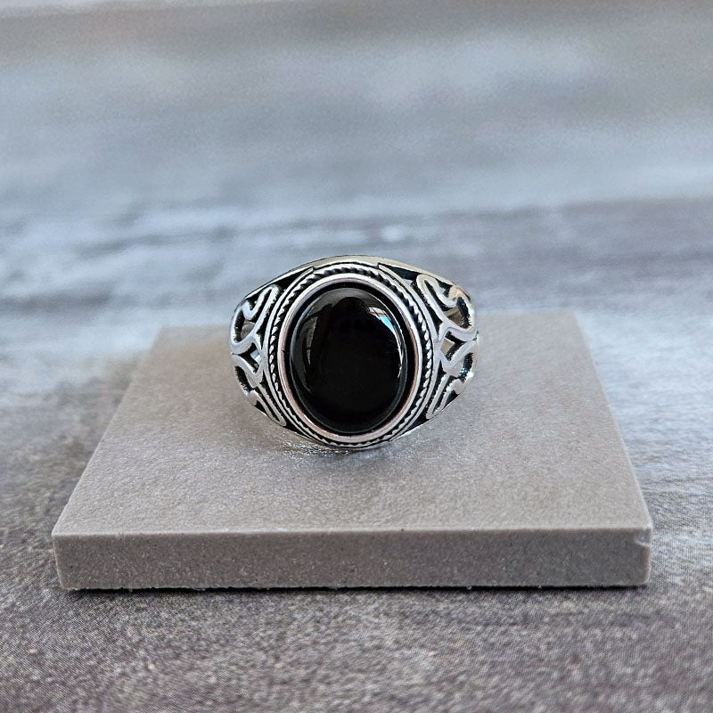 Onyx ring for men with lotus pattern on the sides of the ring. Made with sterling silver