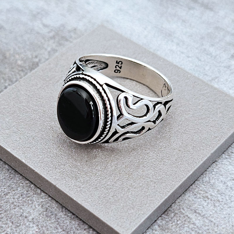 Onyx ring for men with lotus pattern on the sides of the ring. Made with sterling silver
