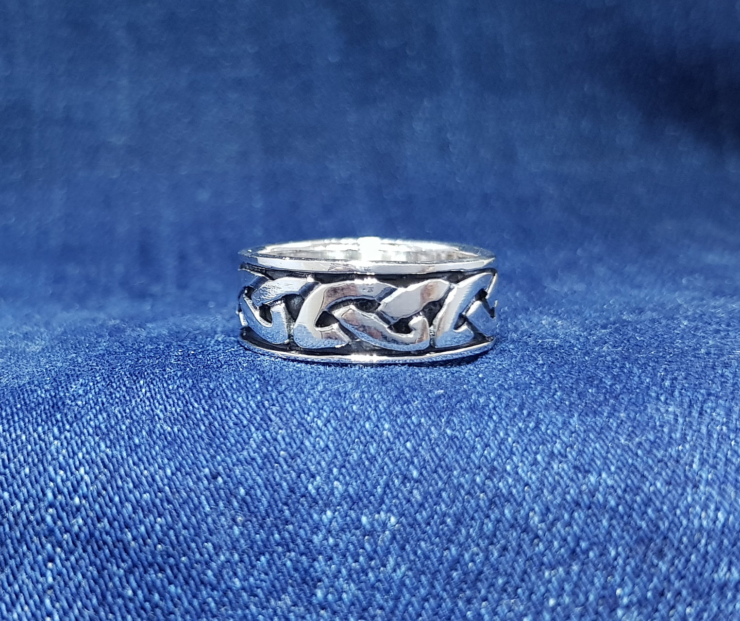 A striking Celtic ring with a bold and intricate design.