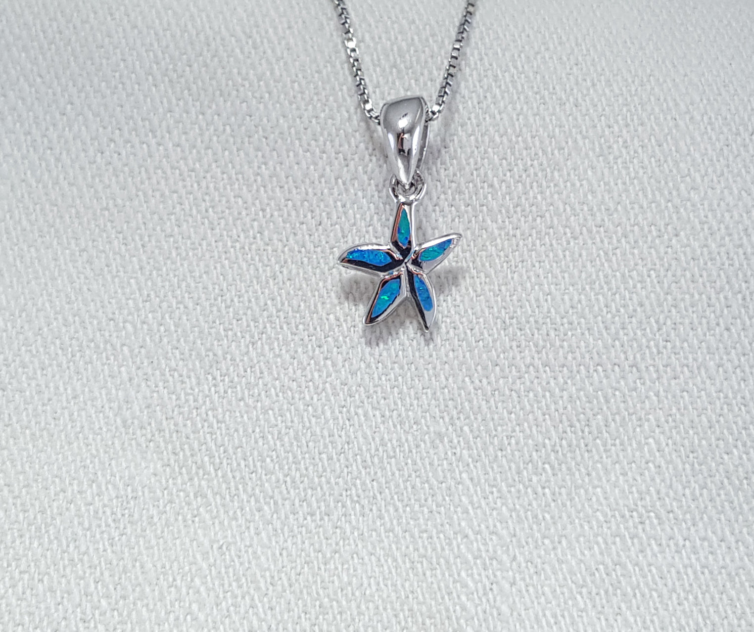 Crushed Opal starfish pendant set in Sterling Silver 