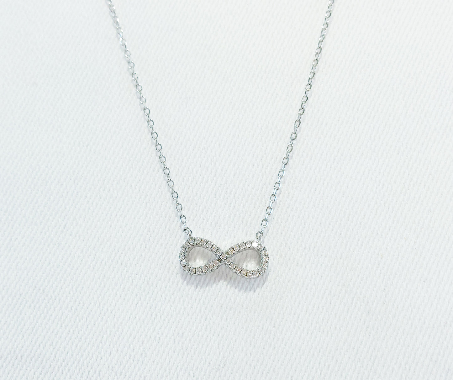 Sterling Silver Cubic Zirconia Necklace. Infinity Symbol Design