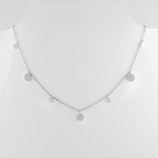 This joyful sterling silver chain is adorned with dainty cubic zirconia encrusted discs spaced between tiny plain discs.