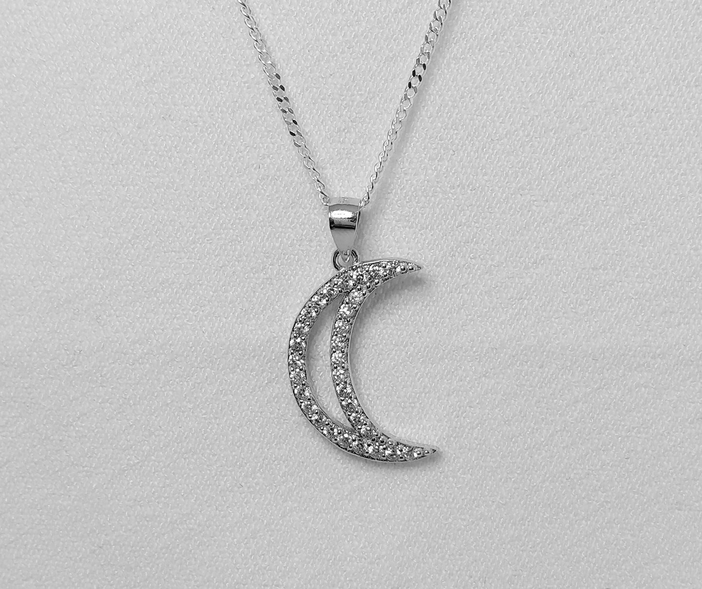 Sterling Silver Crescent Moon pendant with cubic zirconia stones