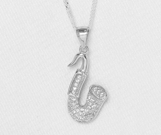 sterling silver saxophone pendant with cubic zirconia stones.