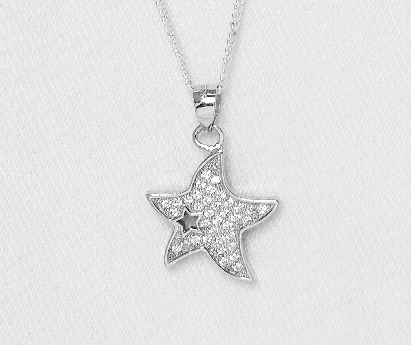 sterling silver star pendant with cubic zirconia stones.
