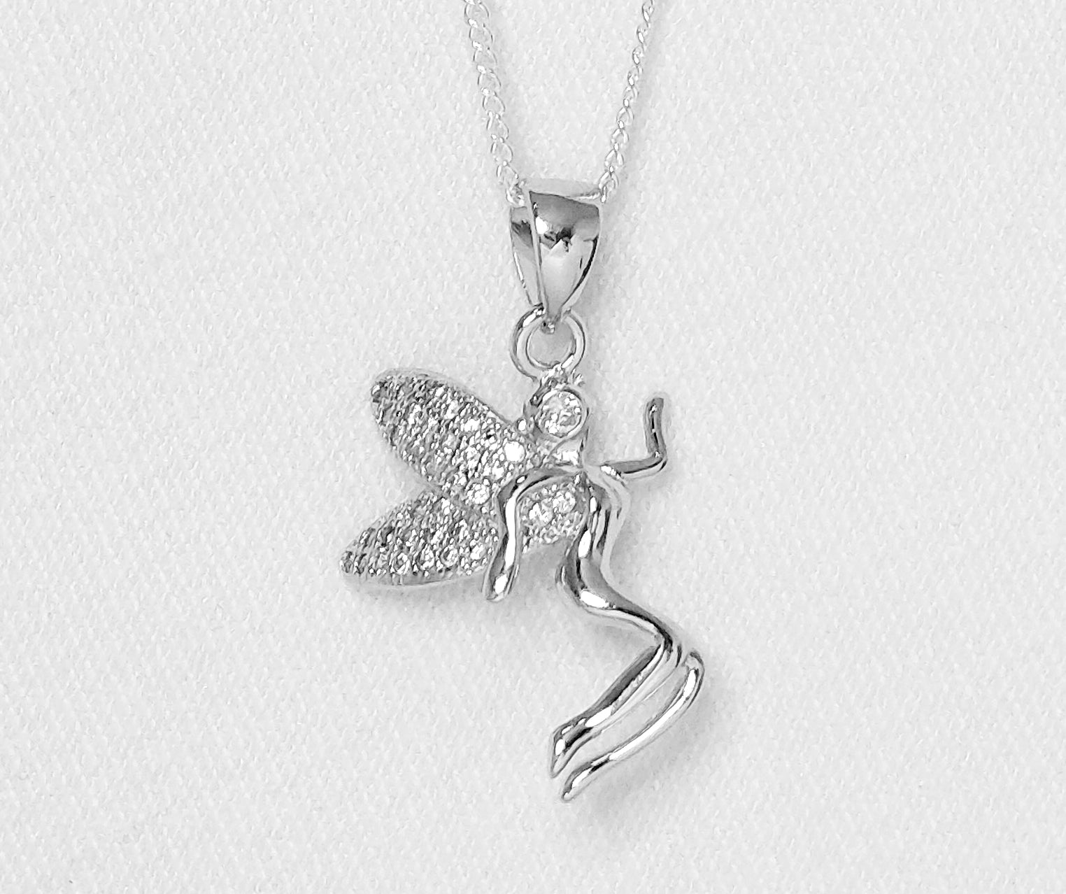 sterling silver fairy pendant with cubic zirconia stones.