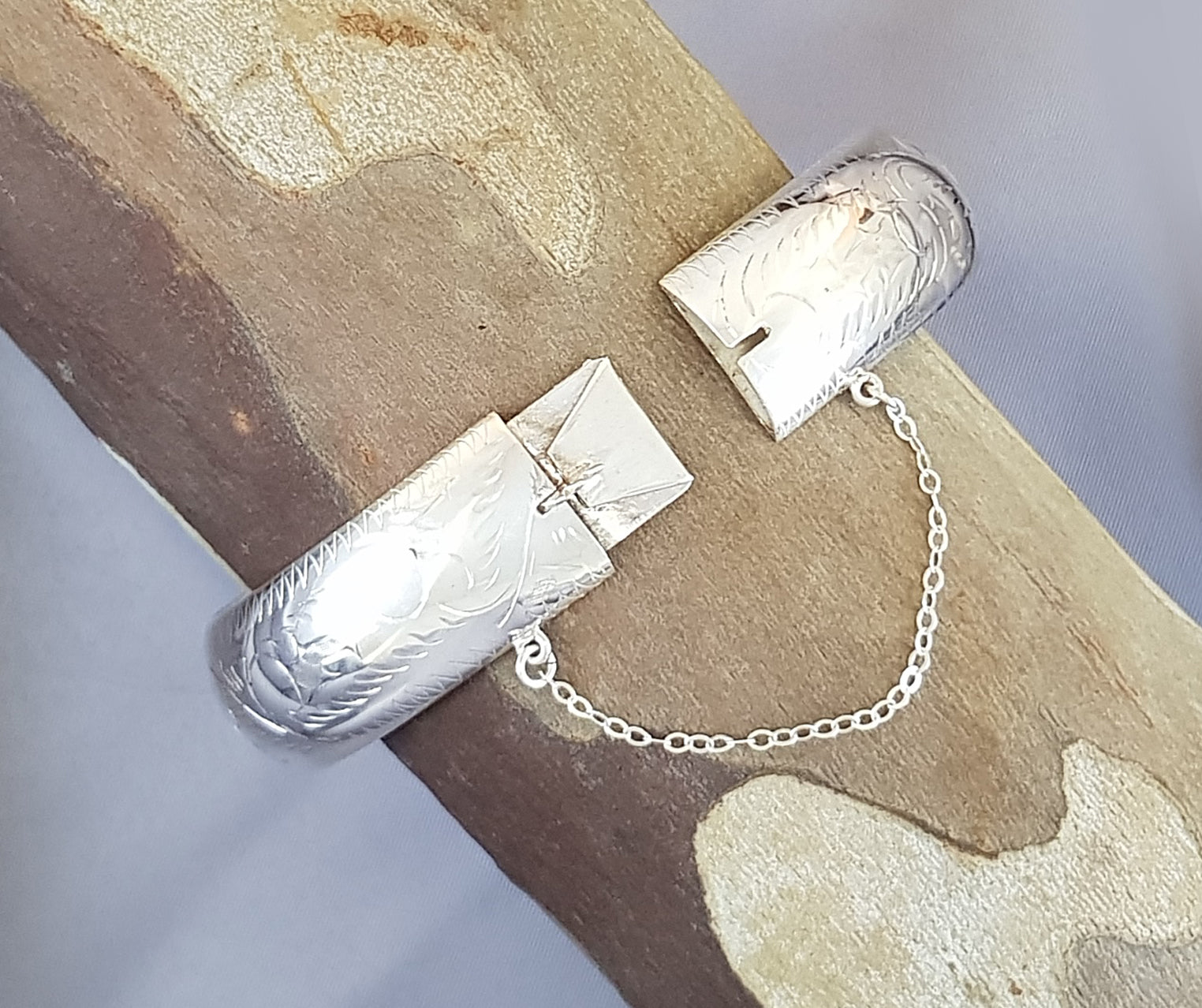 Sterling Silver Hollow Hinge Bangle with Beautiful Engraving and a Safety Chain