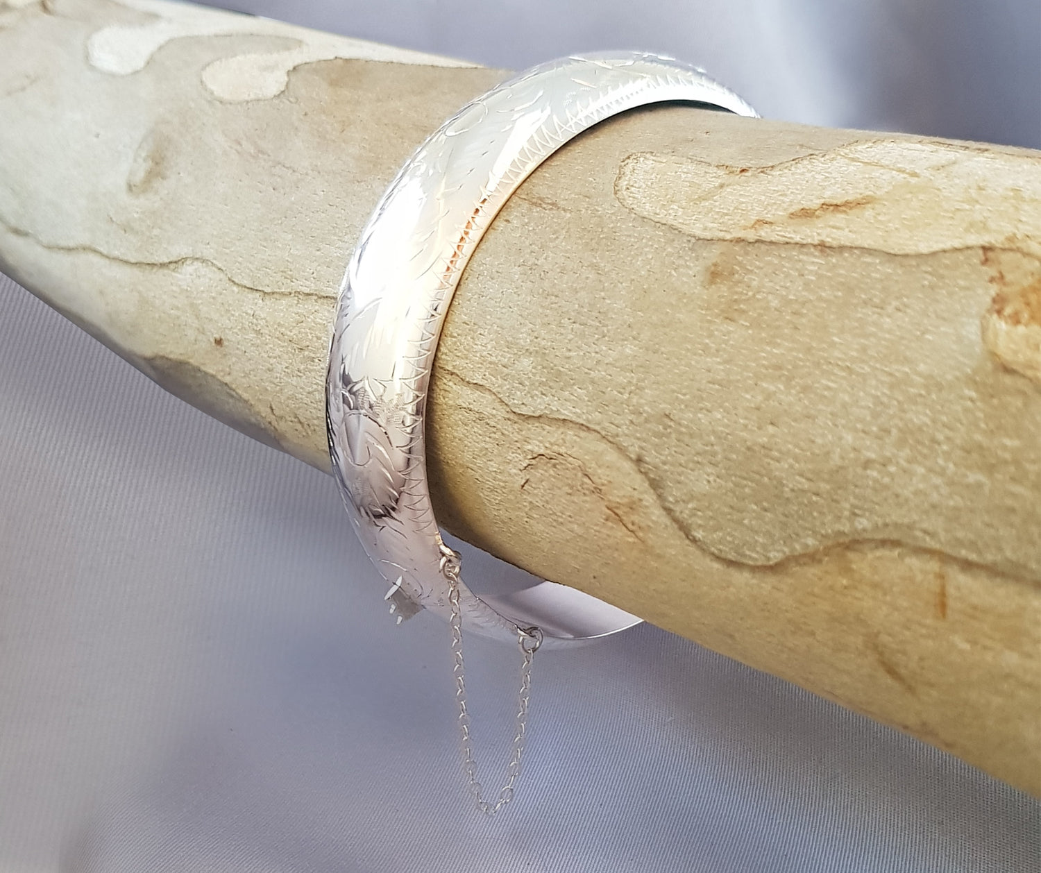 Sterling Silver Hollow Hinge Bangle with Beautiful Engraving and a Safety Chain